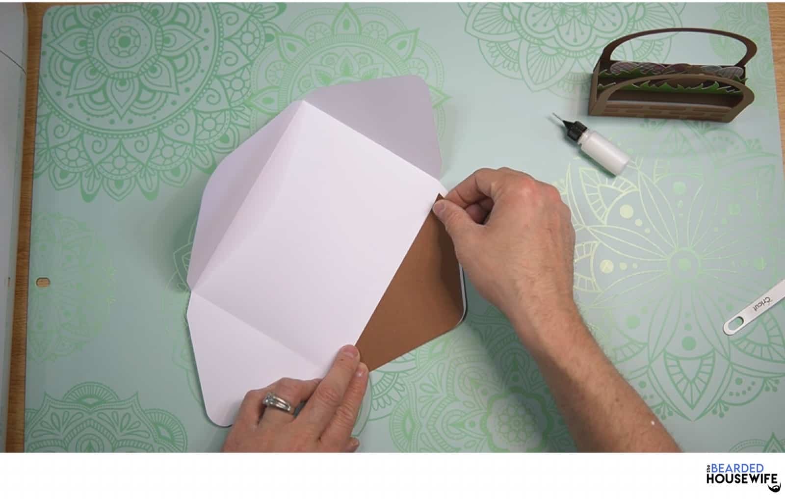 place the inlay onto the envelope