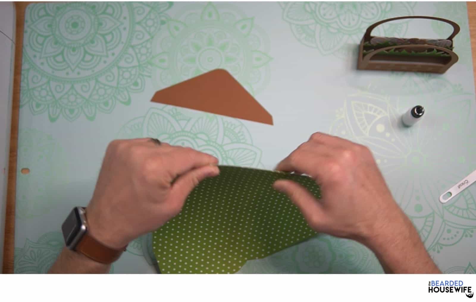 fold the envelope along the score lines