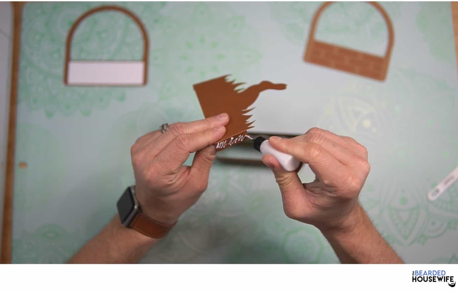 add glue to the outside of the tabs and place the second piece inside the box