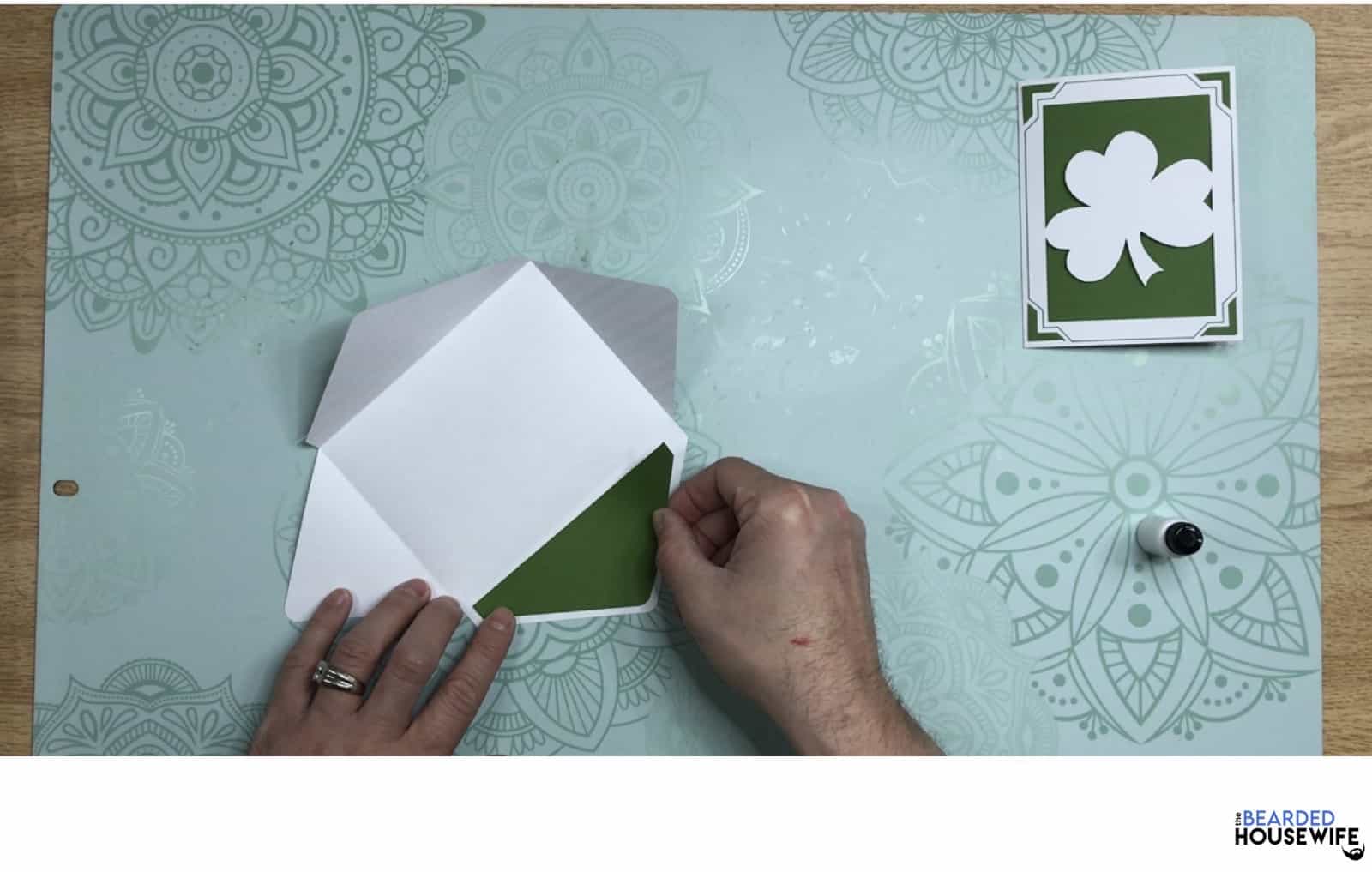 adhere the inlay to the envelope
