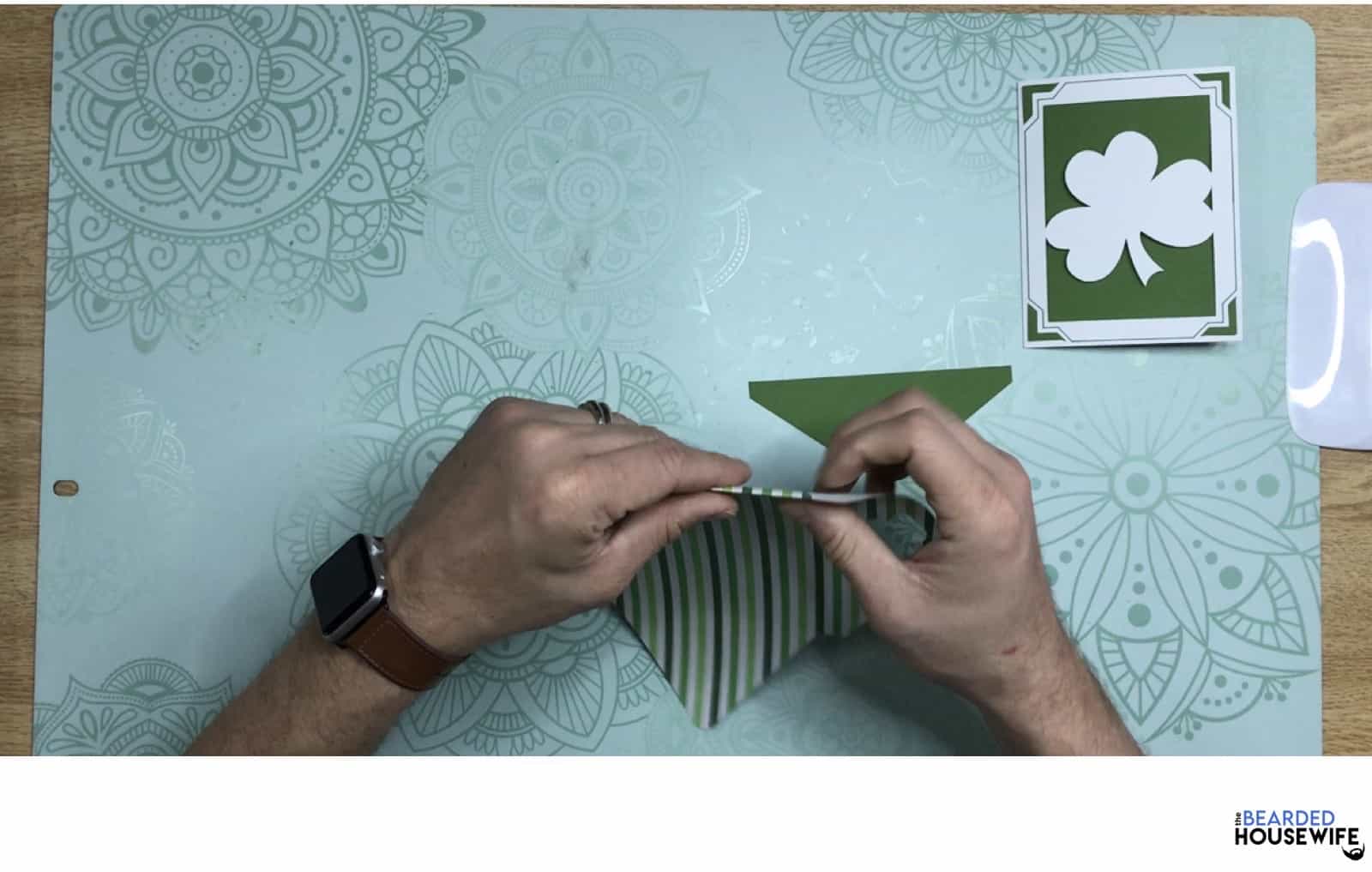 fold the envelope along the score lines