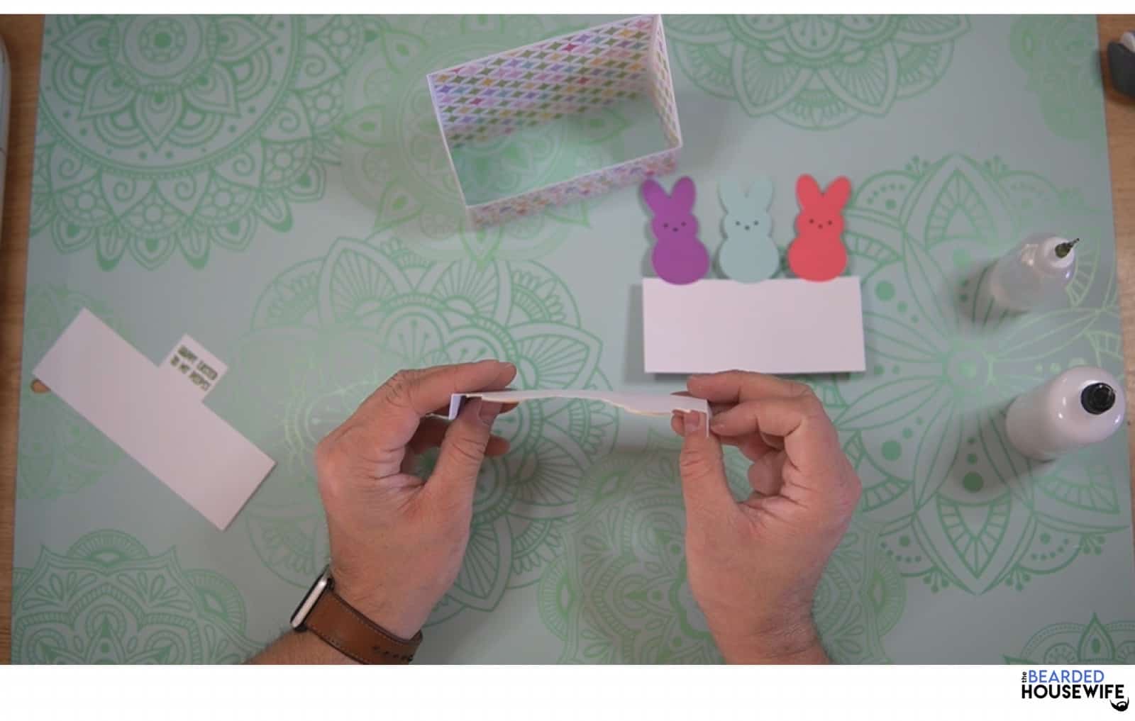 fold the tabs on the chick piece toward you