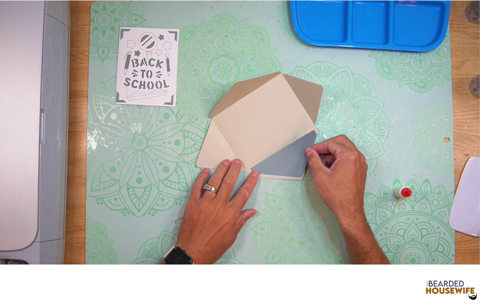 attach the inlay over the cutout on the envelope flap