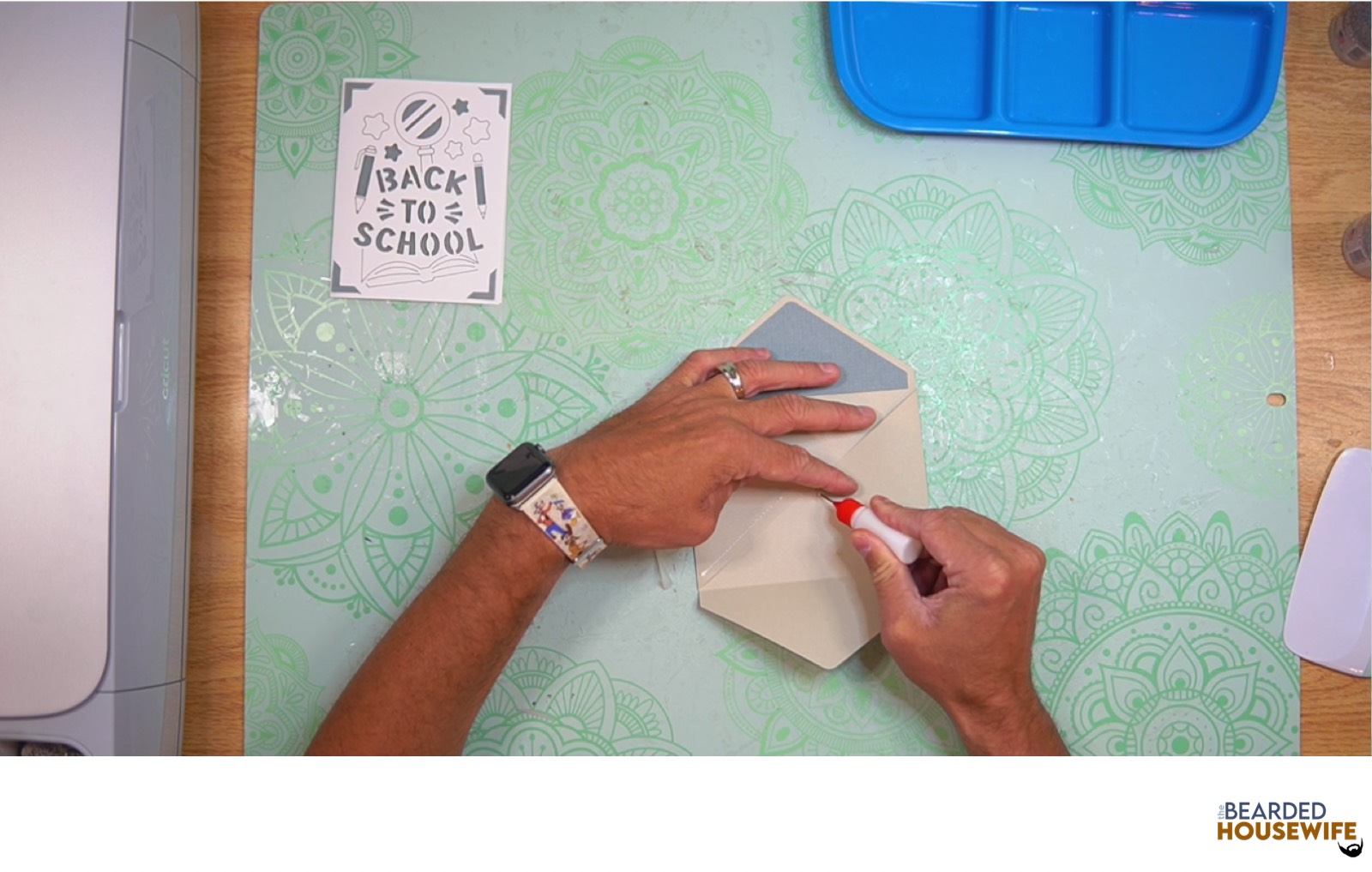 add glue along the bottom of the side flaps