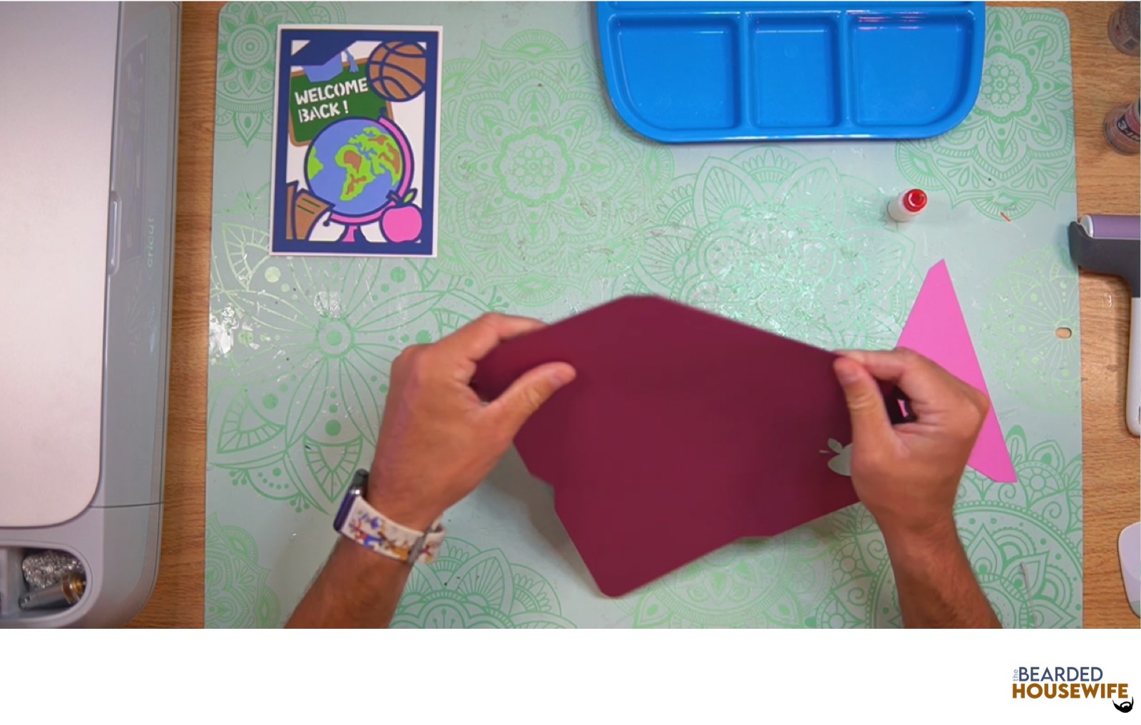 fold the envelope along the score line