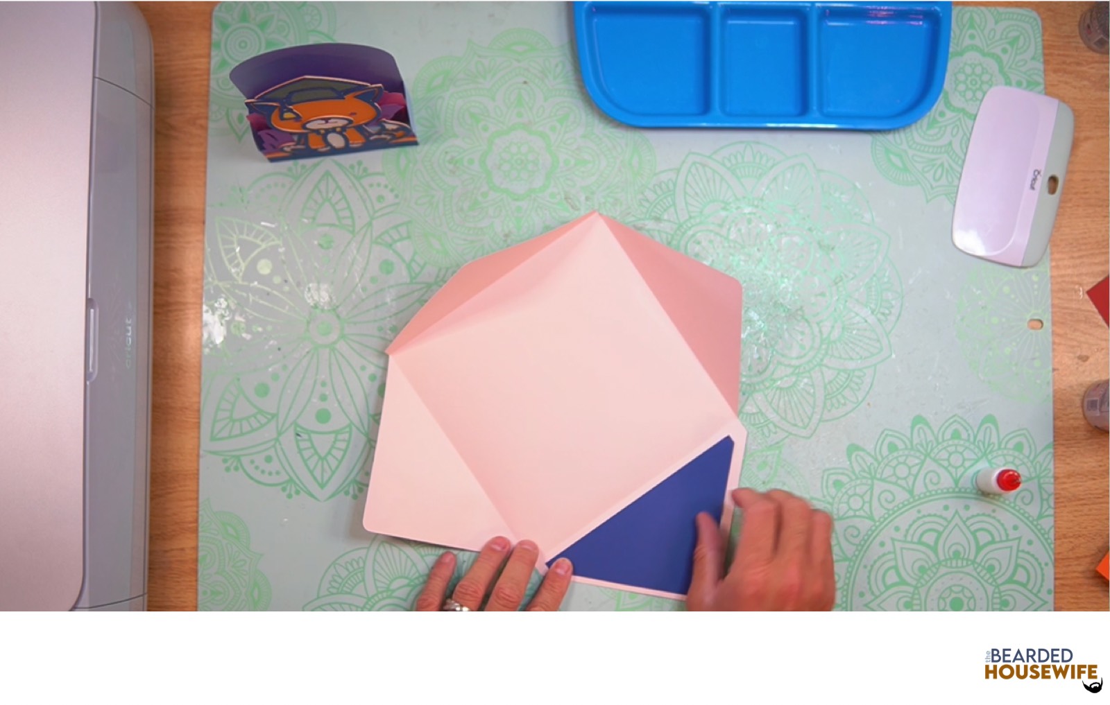 attach the inlay over the cutout on the envelope flap