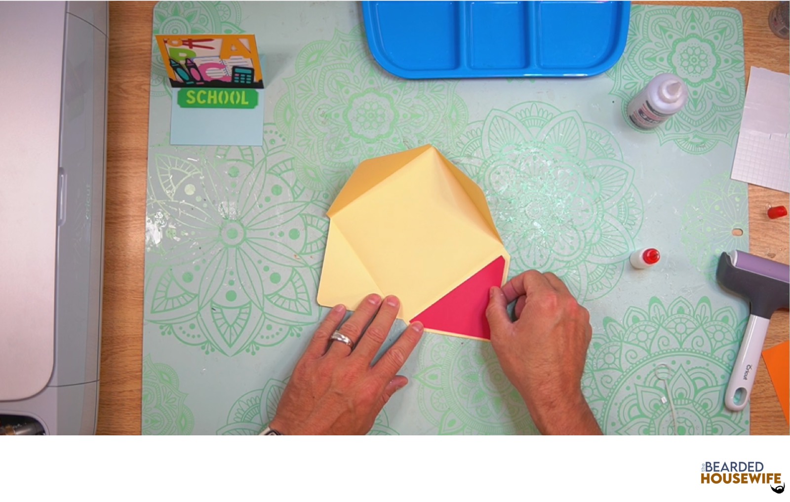 attach the inlay over the cutout on the envelope flap