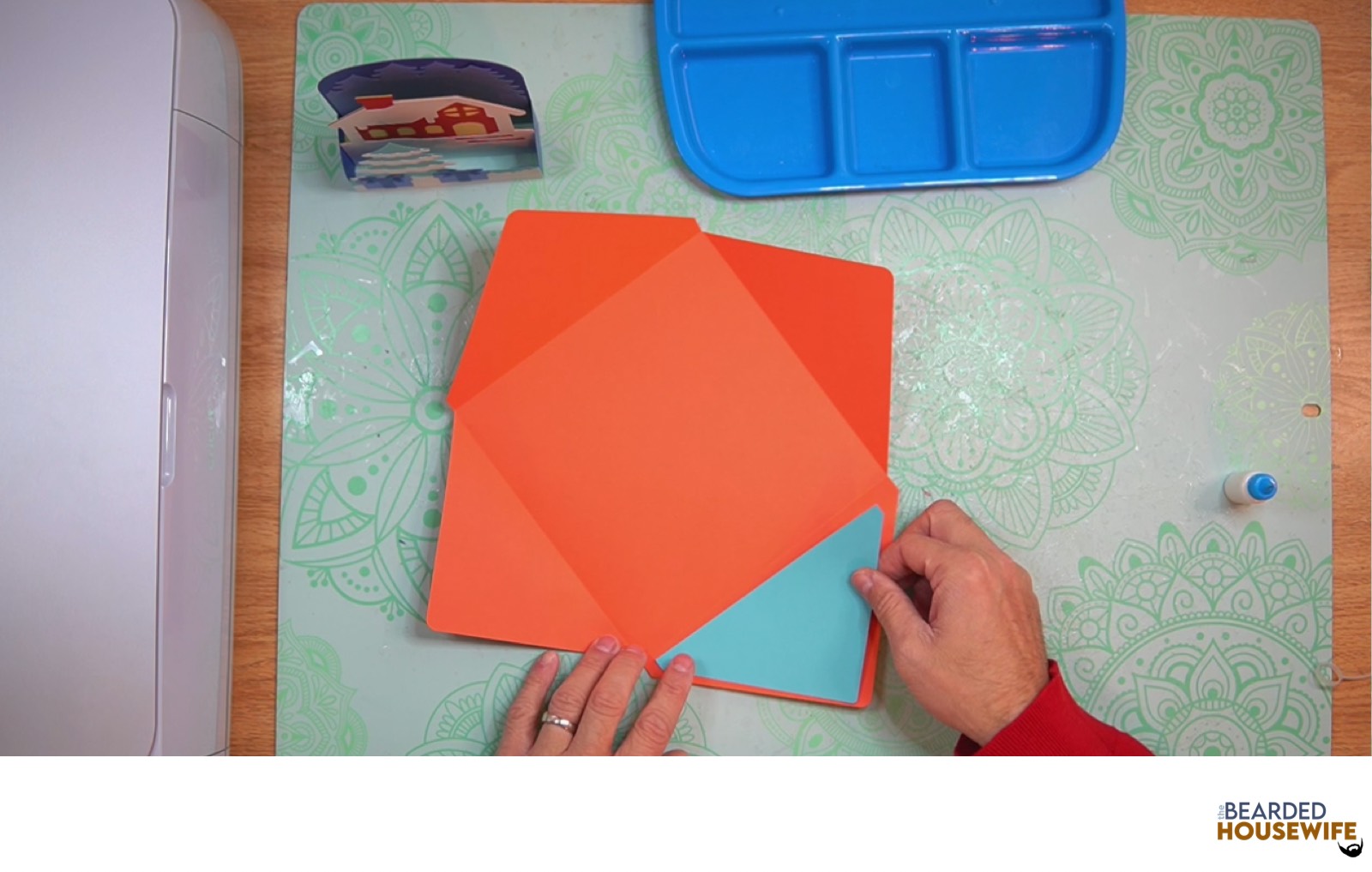 attach the inlay over the cutout on the envelope flap