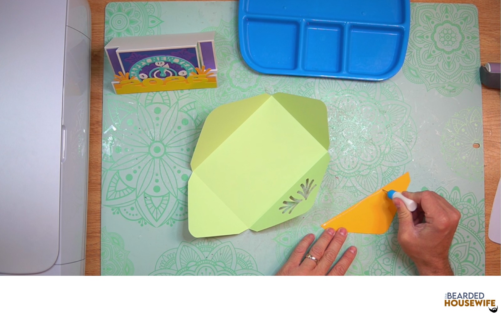 add glue along the outer edge of the inlay panel