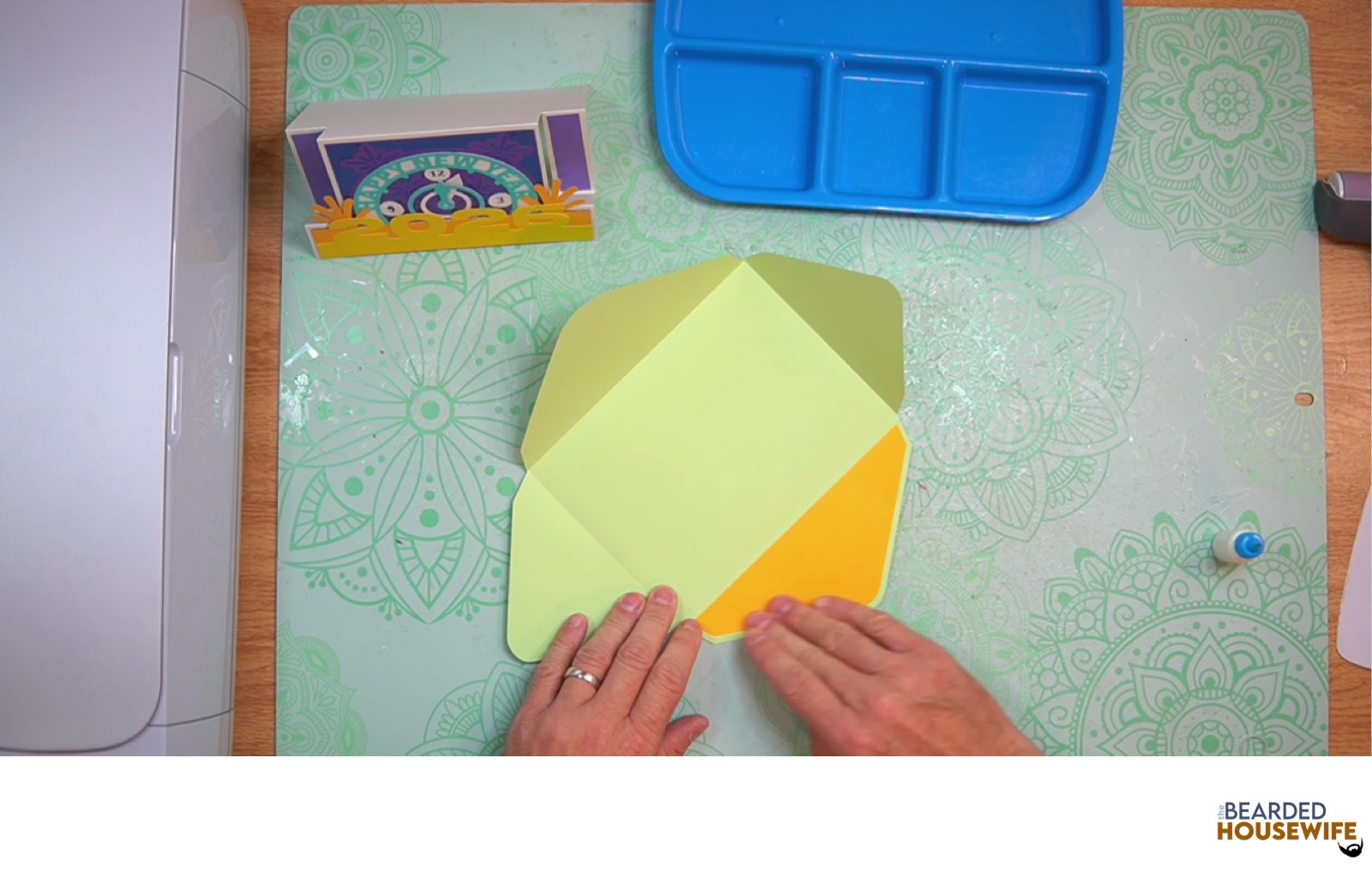 attach the inlay over the cutout on the envelope flap