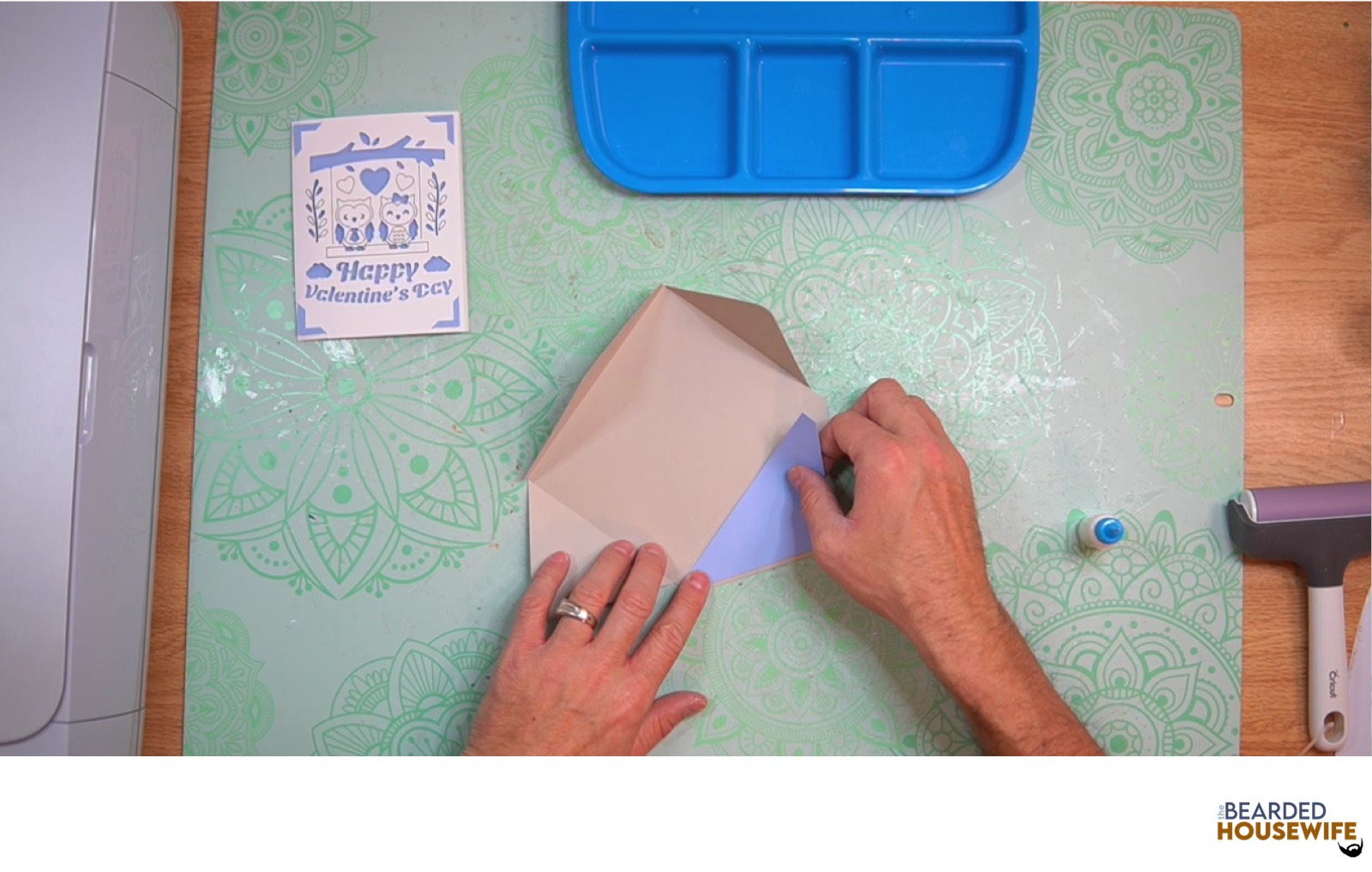 add the inlay to the cutout on the envelope flap