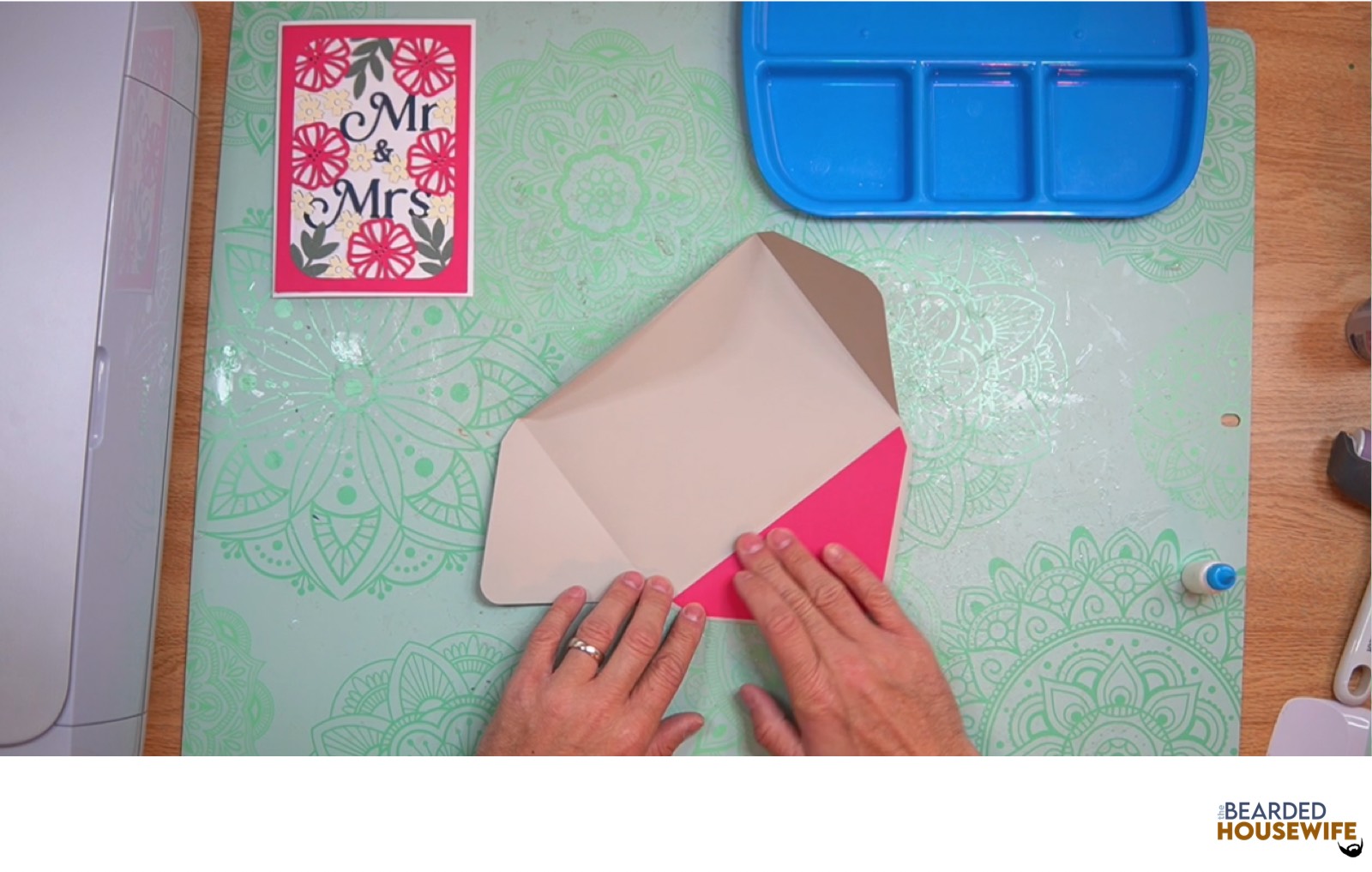 place the inlay over the cutout on the envelope flap