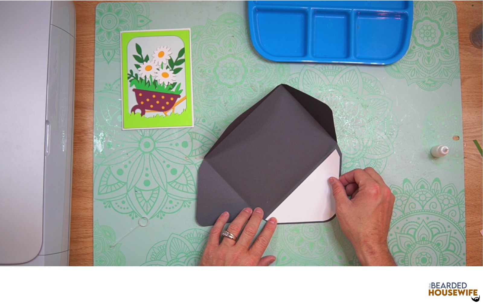attach the inlay over the cutout on the envelope flap