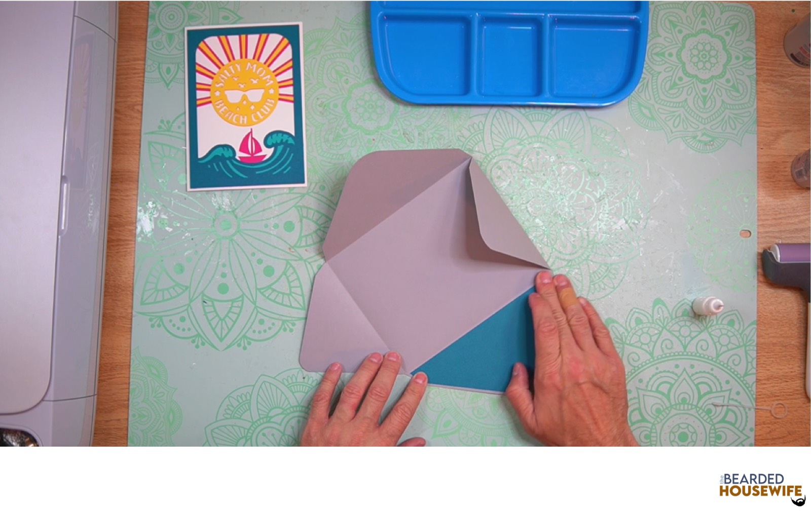 attach the inlay over the cutout on the envelope flap